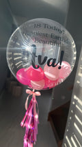 Clear jumbo balloon with mini balloons